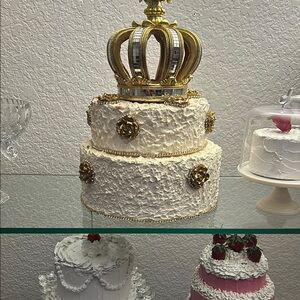 Elegant Two-Tier Cake with Gold Crown Topper